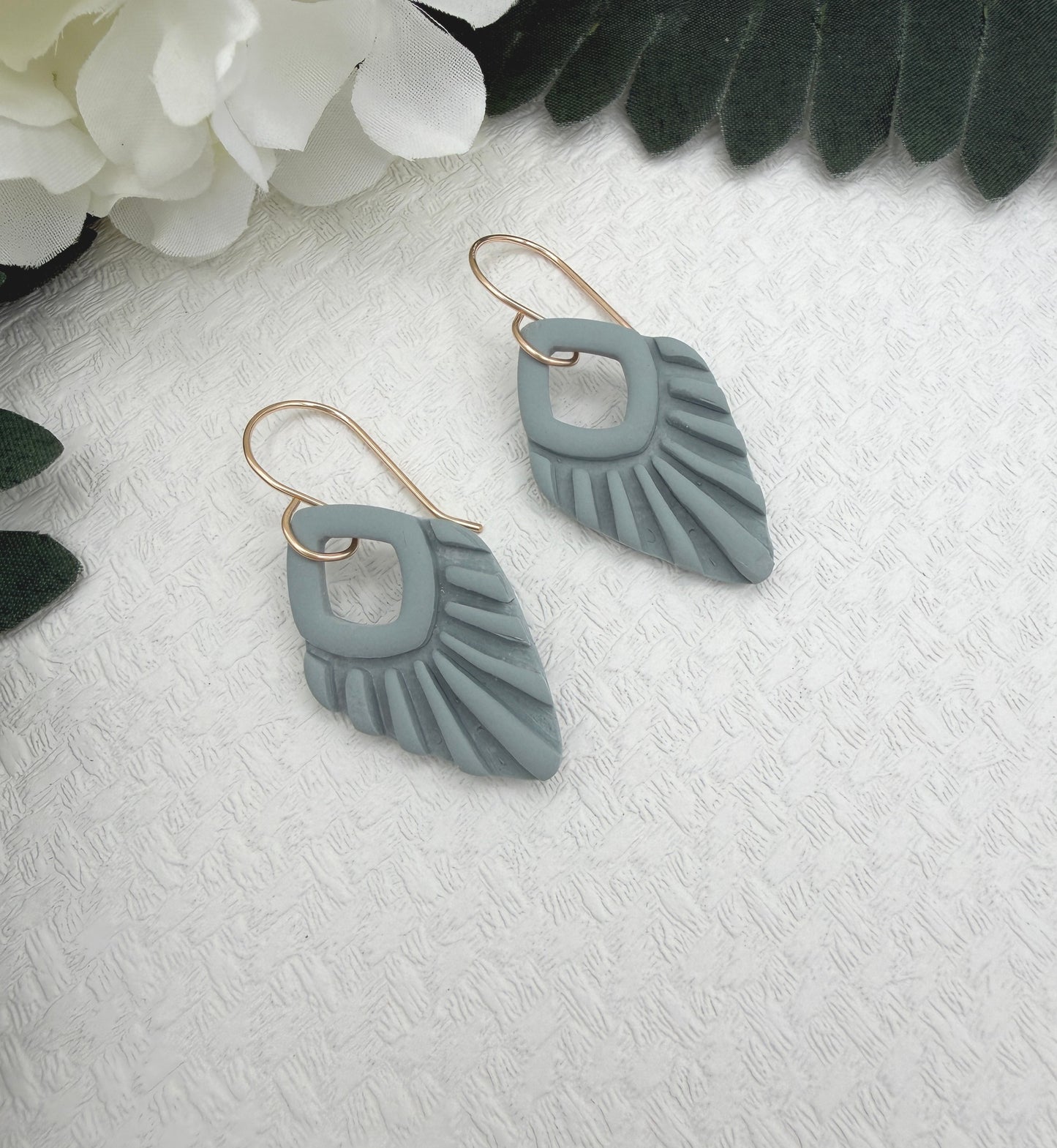 Earrings Made with Blue Polymer Clay Shaped into Lined, Teardrop Frames PCE-1041