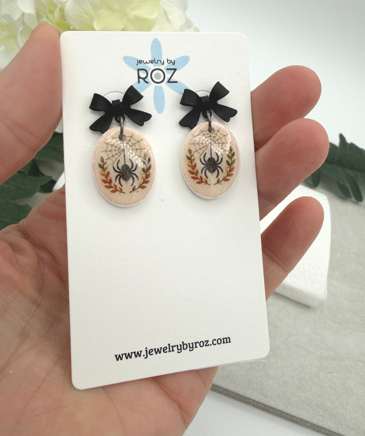 Earrings Made with Black Bow Posts and Polymer Clay Ovals with a Spider Design PCE-1082