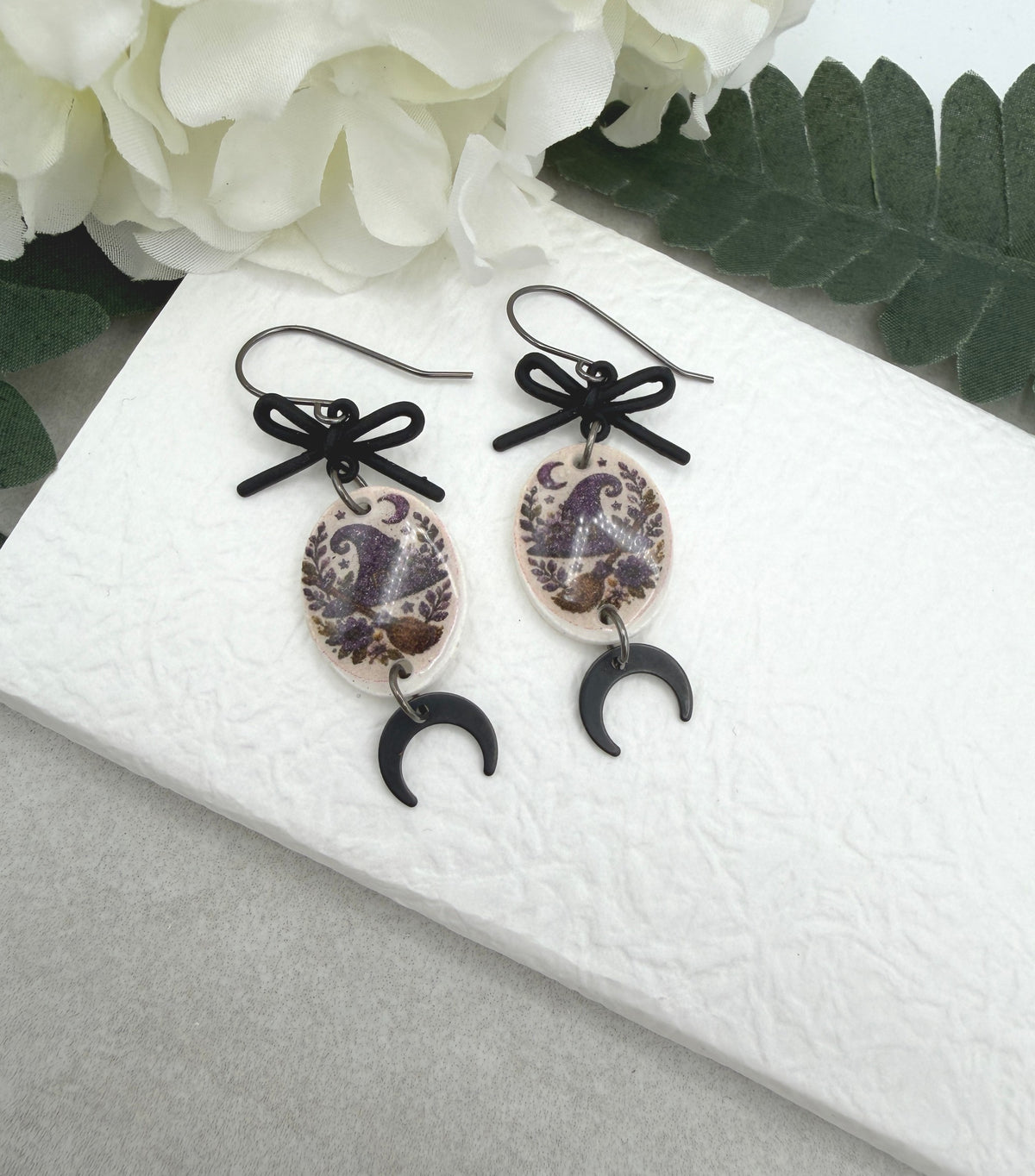 Earrings Made with Black Bow LInks and Polymer Clay Ovals with a Witch Hat Design and Oxidized Silver Earring Wires PCE-1085
