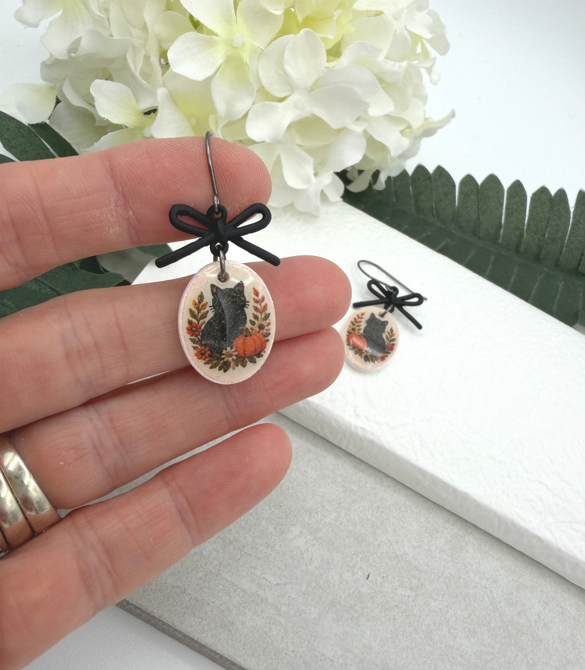 Earrings Made with Black Bow LInks and Polymer Clay Ovals with a Black Cat Design and Oxidized Silver Earring Wires PCE-1081
