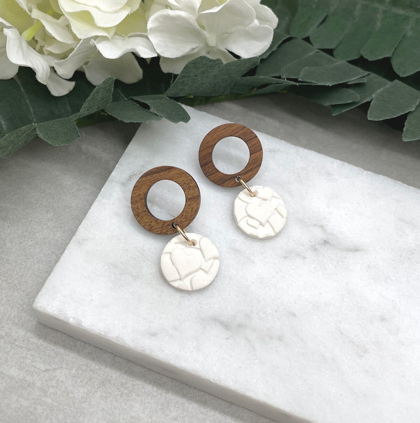 Earrings made with White Polymer Clay Circles Textured with Hearts and Wood Circle Posts PCE-612