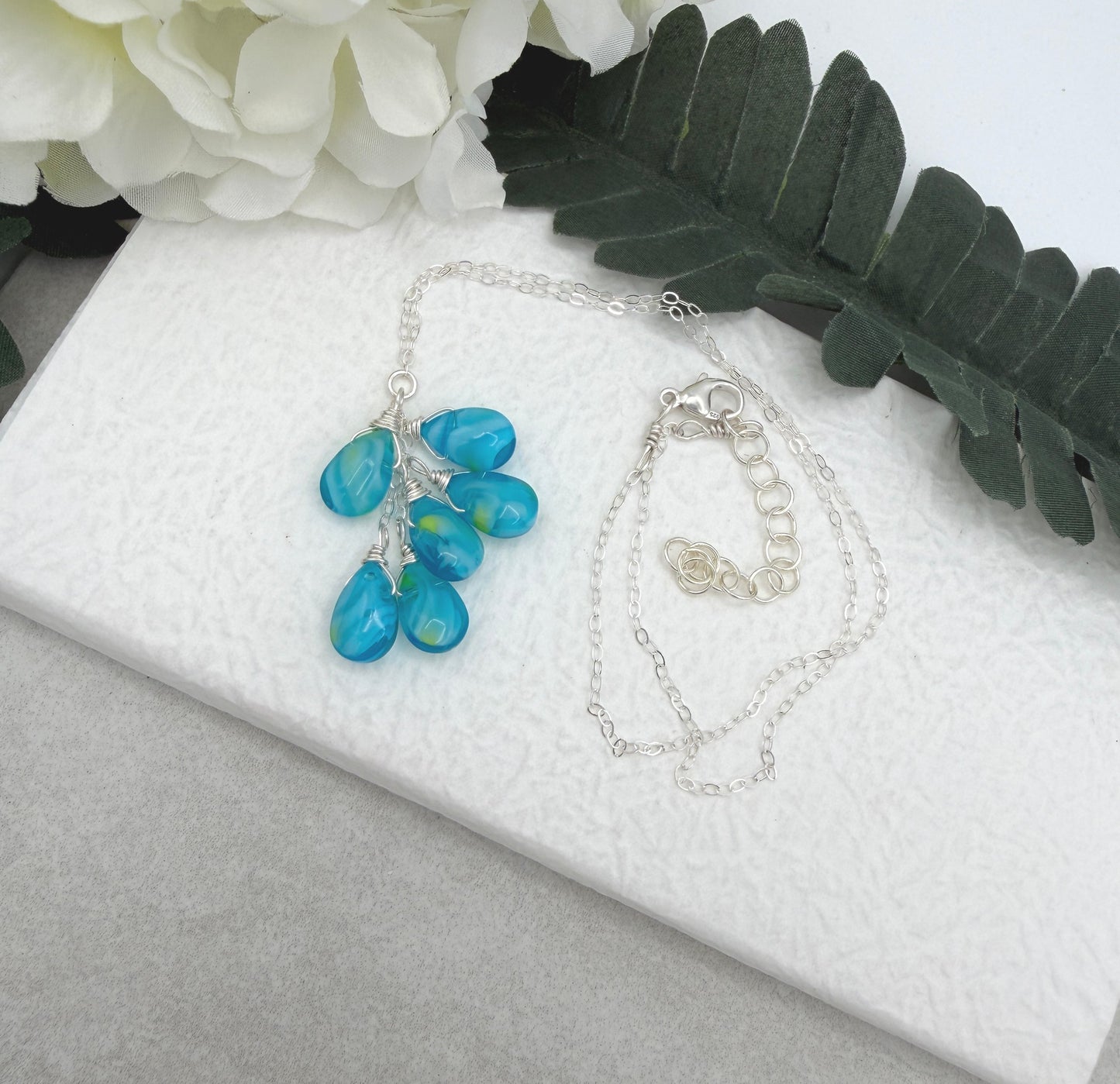 Necklace with a Cascade of Wire Wrapped, Blue and Yellow Glass Teardrops CDN-939