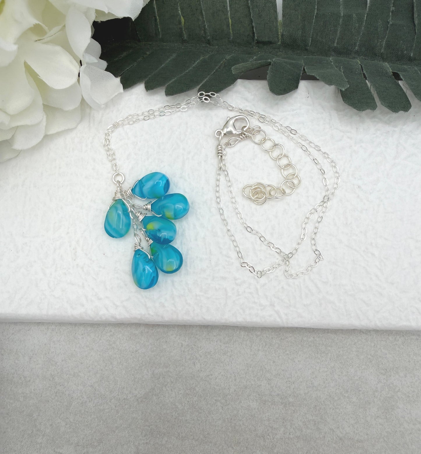 Necklace with a Cascade of Wire Wrapped, Blue and Yellow Glass Teardrops CDN-939