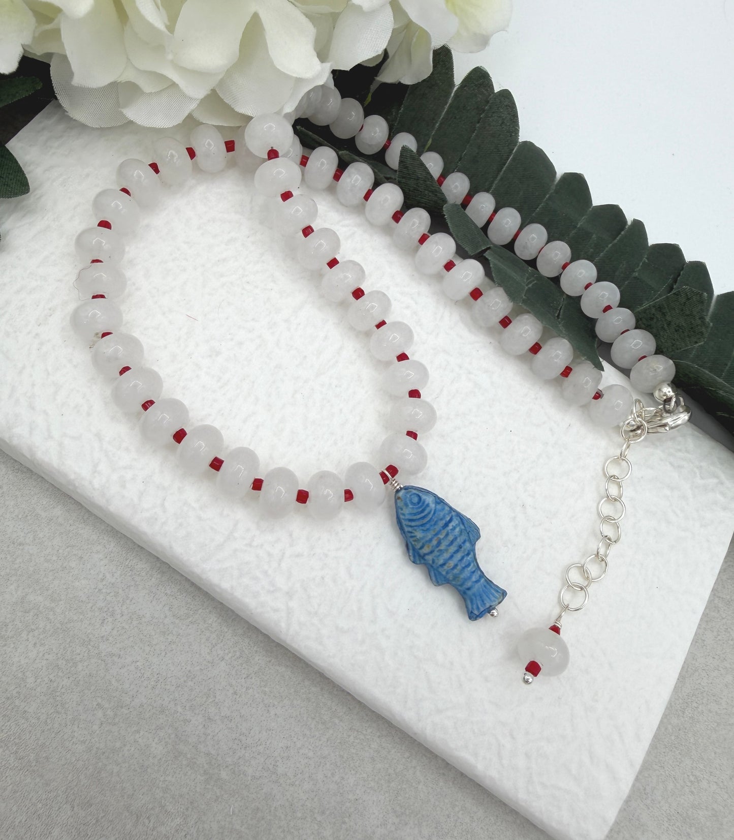Necklace with White Jade Beads and Red Spacers with a Blue, Czech Glass Fish CDN-959