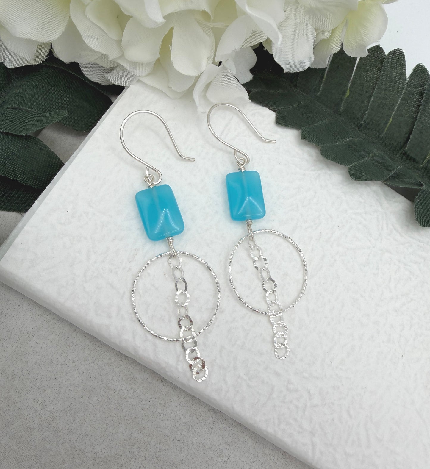 Earrings with Blue Rectangular Beads, Diamond Cut Loops and a Chain Drop CHE-511