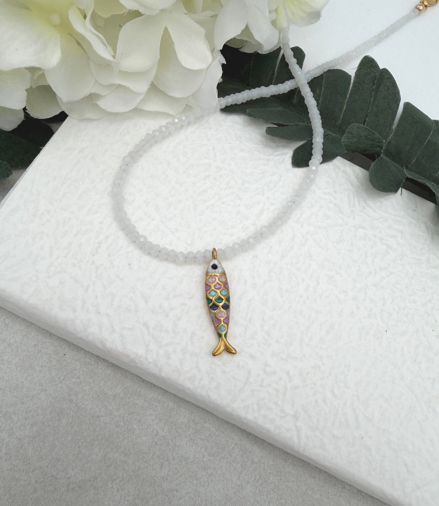 Necklace with Tiny, White Crystal Beads and a Gold Plated, Rainbow Enamled Fish Charm GCDN-212