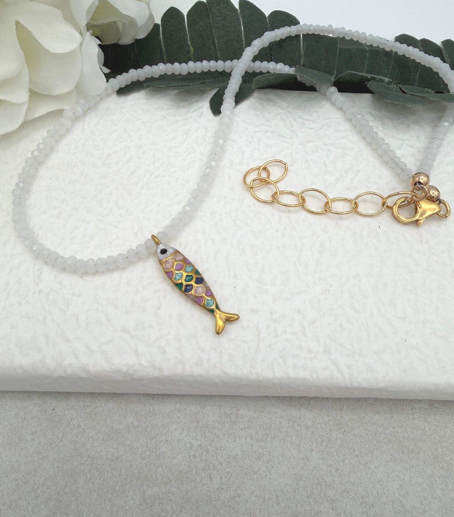 Necklace with Tiny, White Crystal Beads and a Gold Plated, Rainbow Enamled Fish Charm GCDN-212