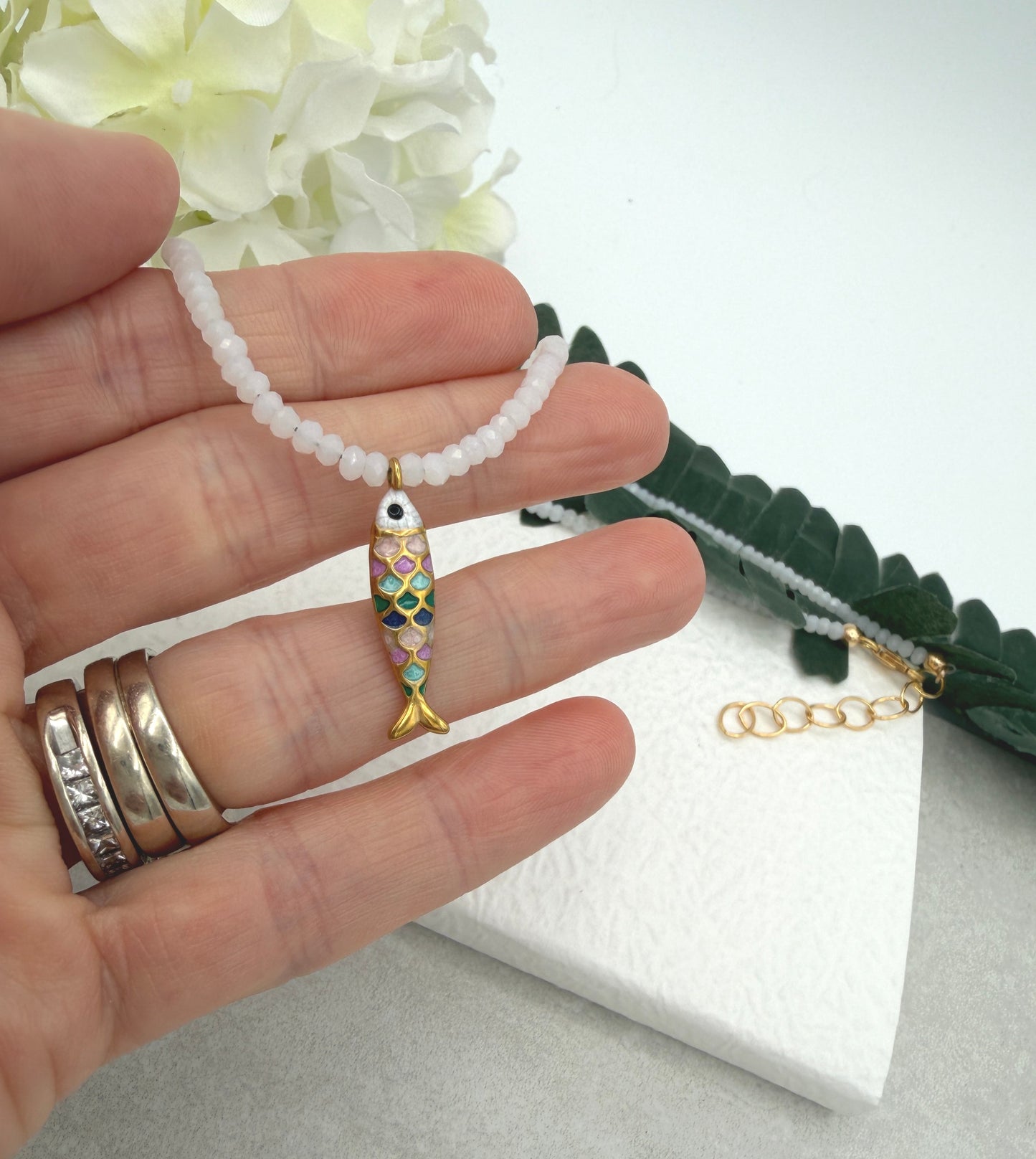 Necklace with Tiny, White Crystal Beads and a Gold Plated, Rainbow Enamled Fish Charm GCDN-212