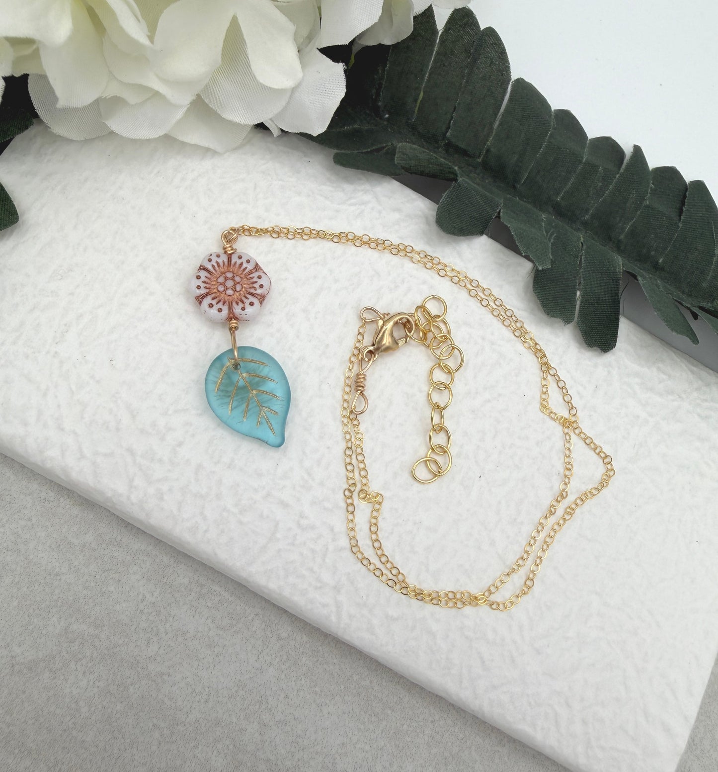 Necklace with a Pink,  Czech Glass Flower and Blue, Czech Glass Leaf GCDN-219