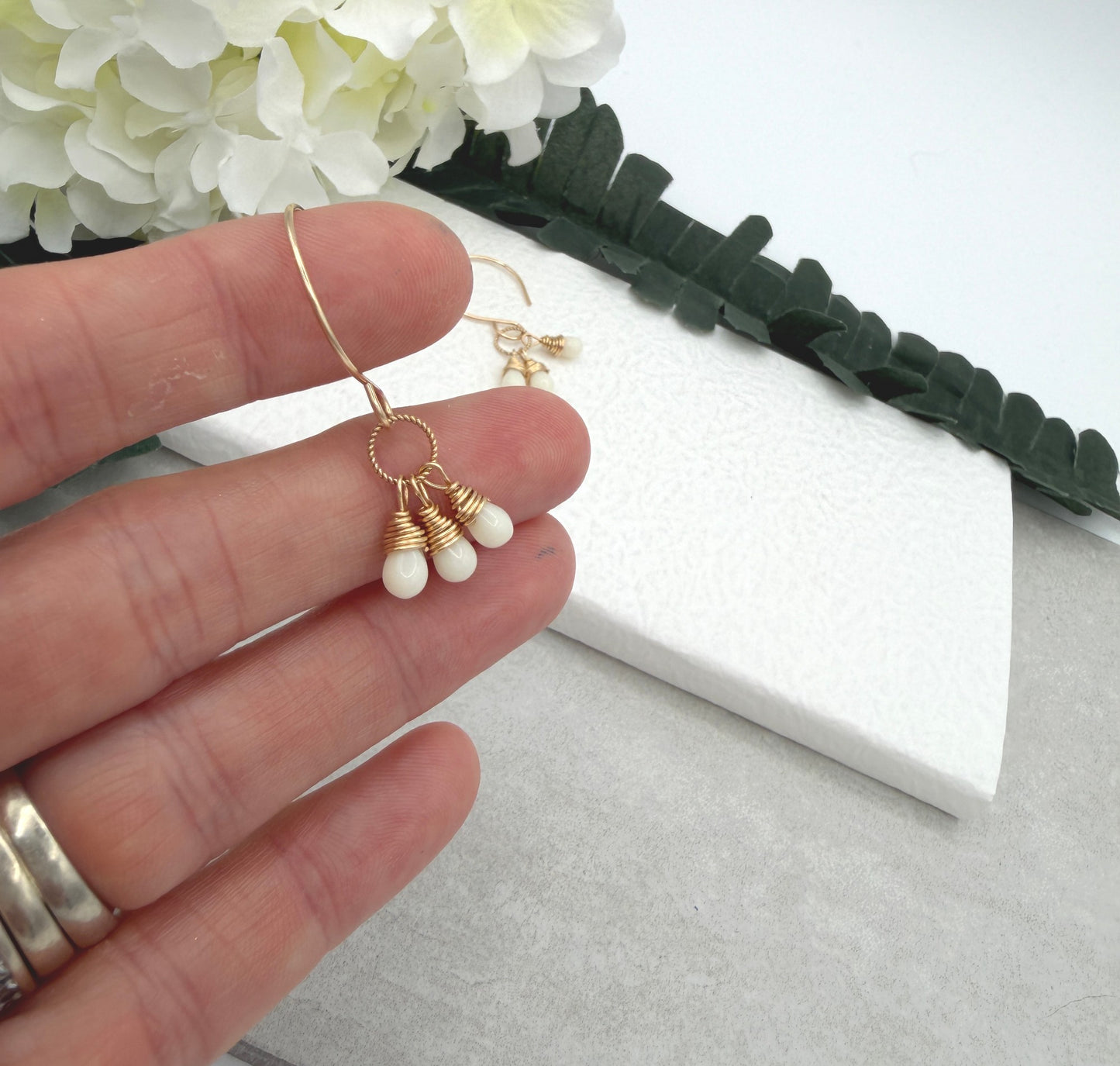 Earrings with Cream Glass Teardrops Wrapped onto Braided Gold Loops GCHE-116