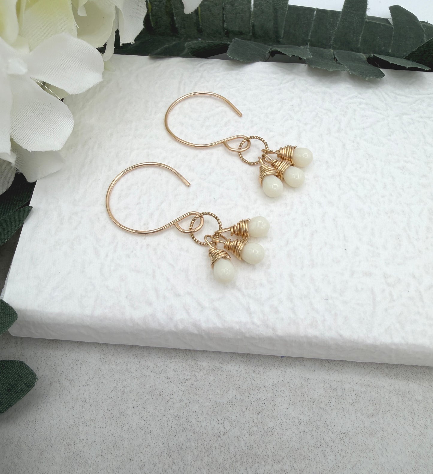 Earrings with Cream Glass Teardrops Wrapped onto Braided Gold Loops GCHE-116