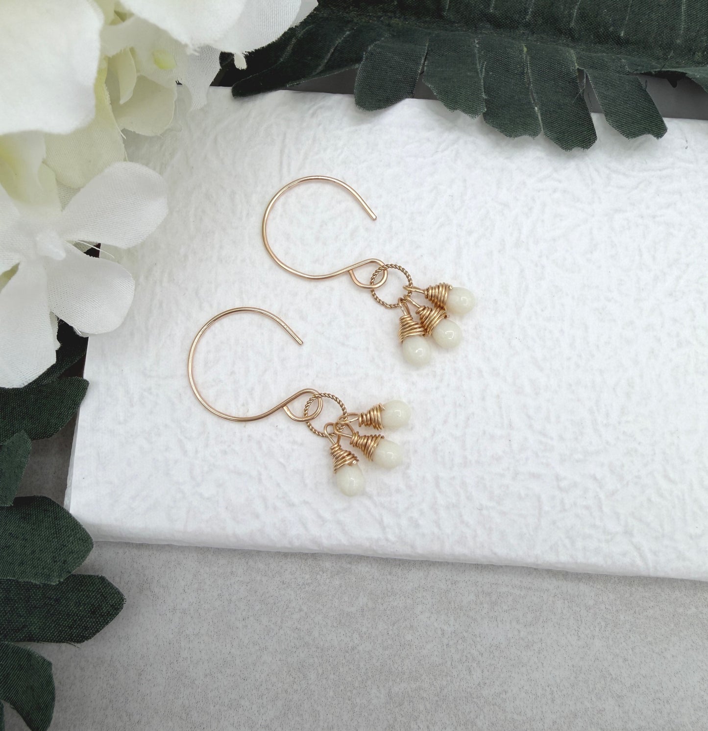 Earrings with Cream Glass Teardrops Wrapped onto Braided Gold Loops GCHE-116