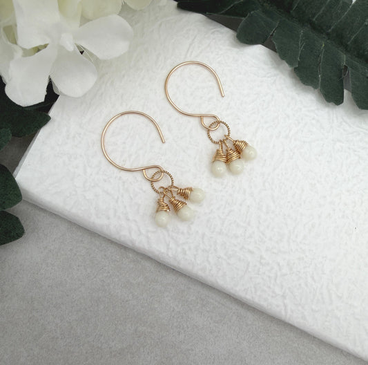 Earrings with Cream Glass Teardrops Wrapped onto Braided Gold Loops GCHE-116