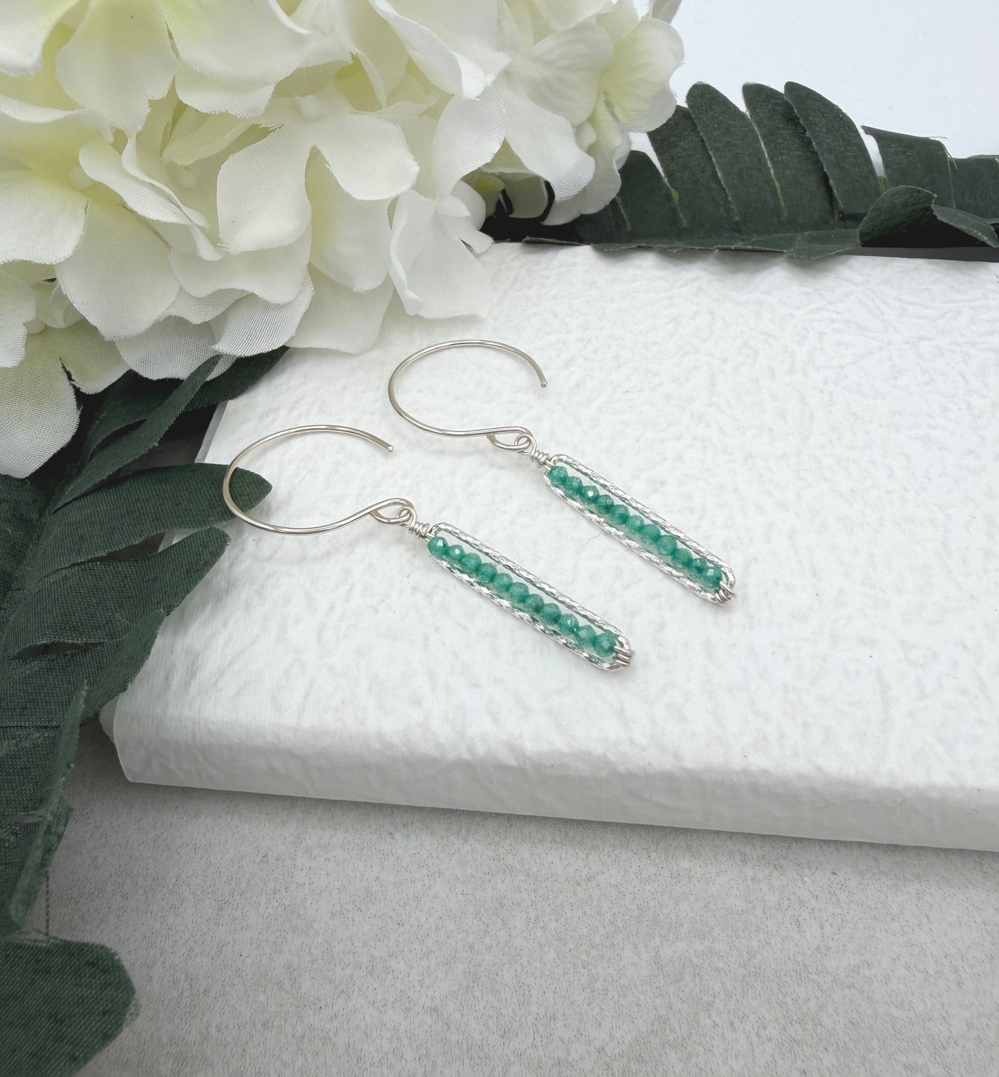 Earrings with Wire Wrapped Sea Foam Cubic Zirconia and Diamond Cut Paperclip Loops HE-556