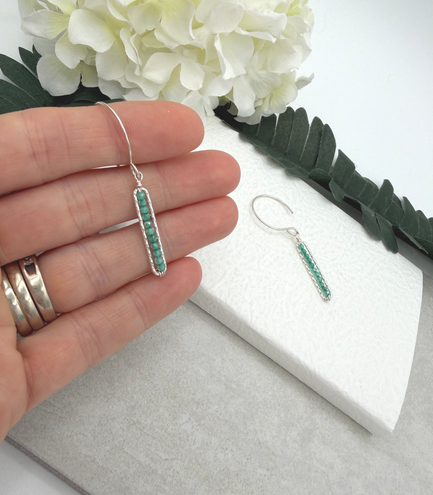 Earrings with Wire Wrapped Sea Foam Cubic Zirconia and Diamond Cut Paperclip Loops HE-556