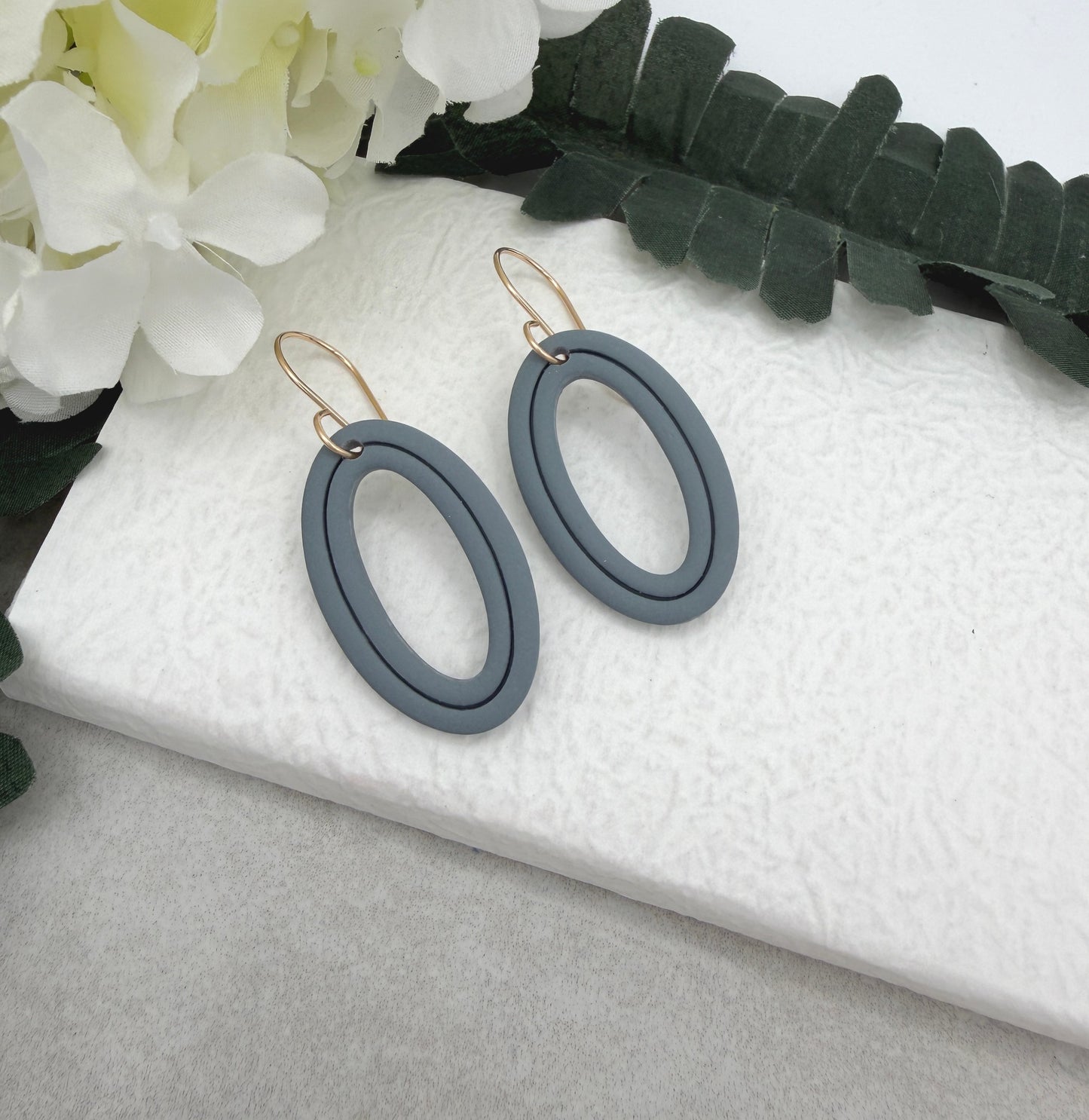Earrings Made with Blue Polymer Clay Shaped into Lined, Oval Frames PCE-1021