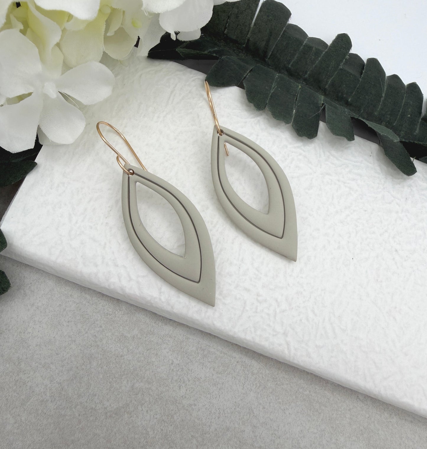 Earrings Made with Beige Polymer Clay Shaped into Lined, Teardrop Frames PCE-1022