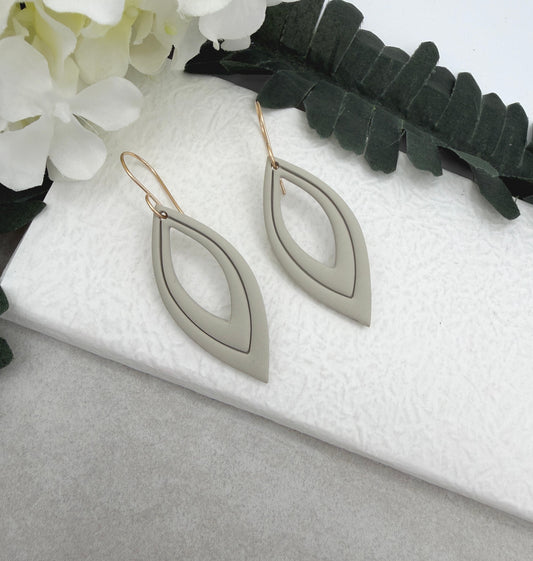 Earrings Made with Beige Polymer Clay Shaped into Lined, Teardrop Frames PCE-1022