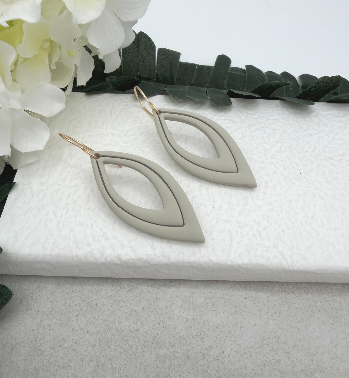 Earrings Made with Beige Polymer Clay Shaped into Lined, Teardrop Frames PCE-1022