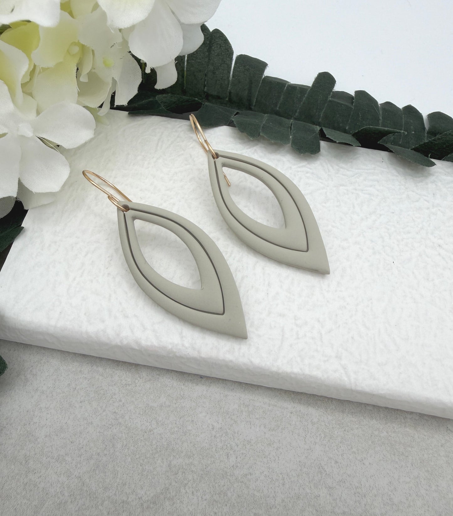 Earrings Made with Beige Polymer Clay Shaped into Lined, Teardrop Frames PCE-1022