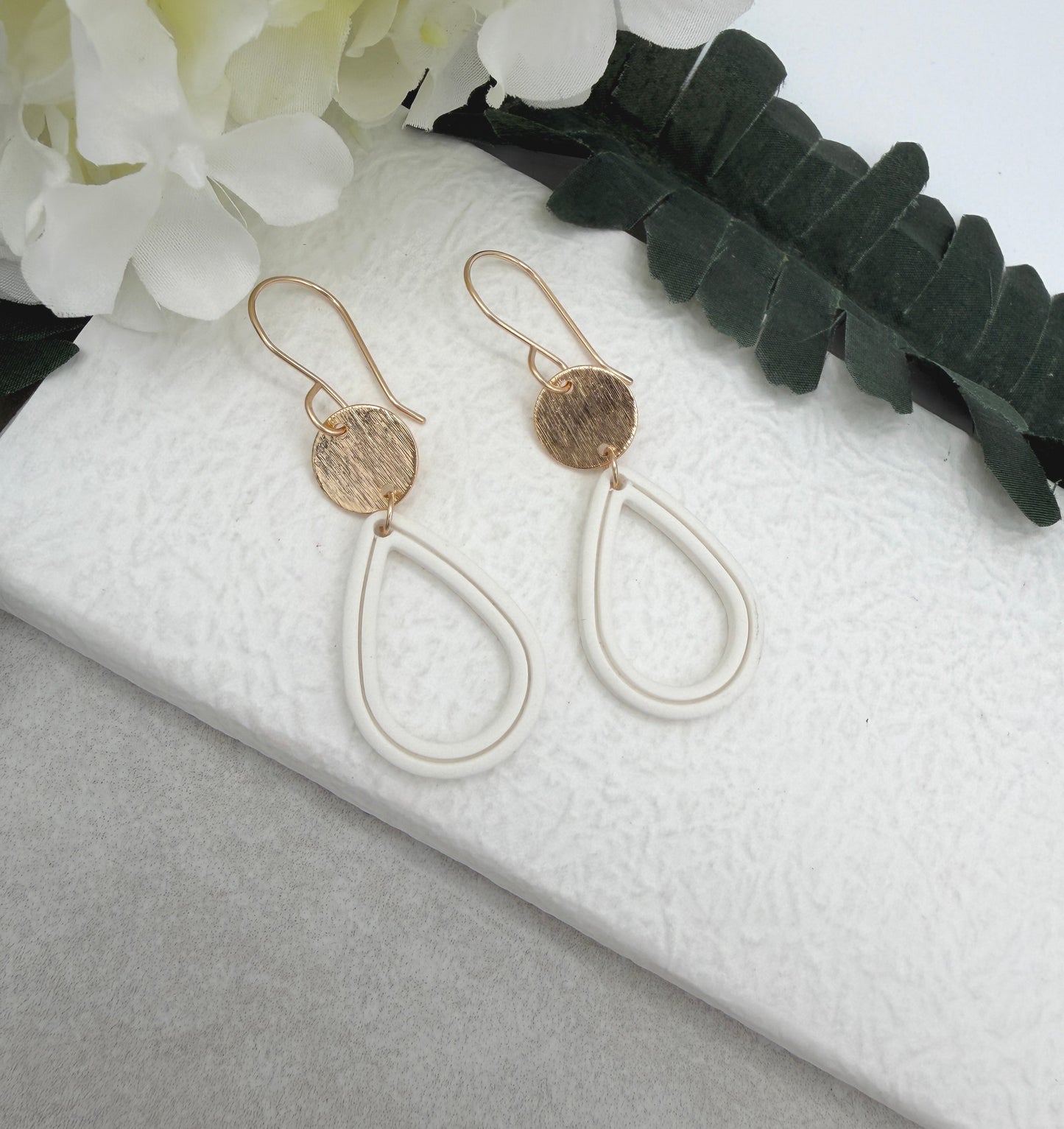Earrings Made with Gold Plated Circles and White Polymer Clay Shaped into Lined, Teardrop Frames PCE-1023