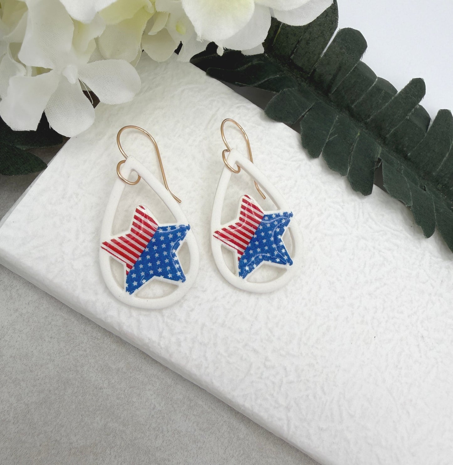 Earrings Made with White Polymer Clay Lined, Teardrop Frames with Stars and Strips Stars PCE-1036