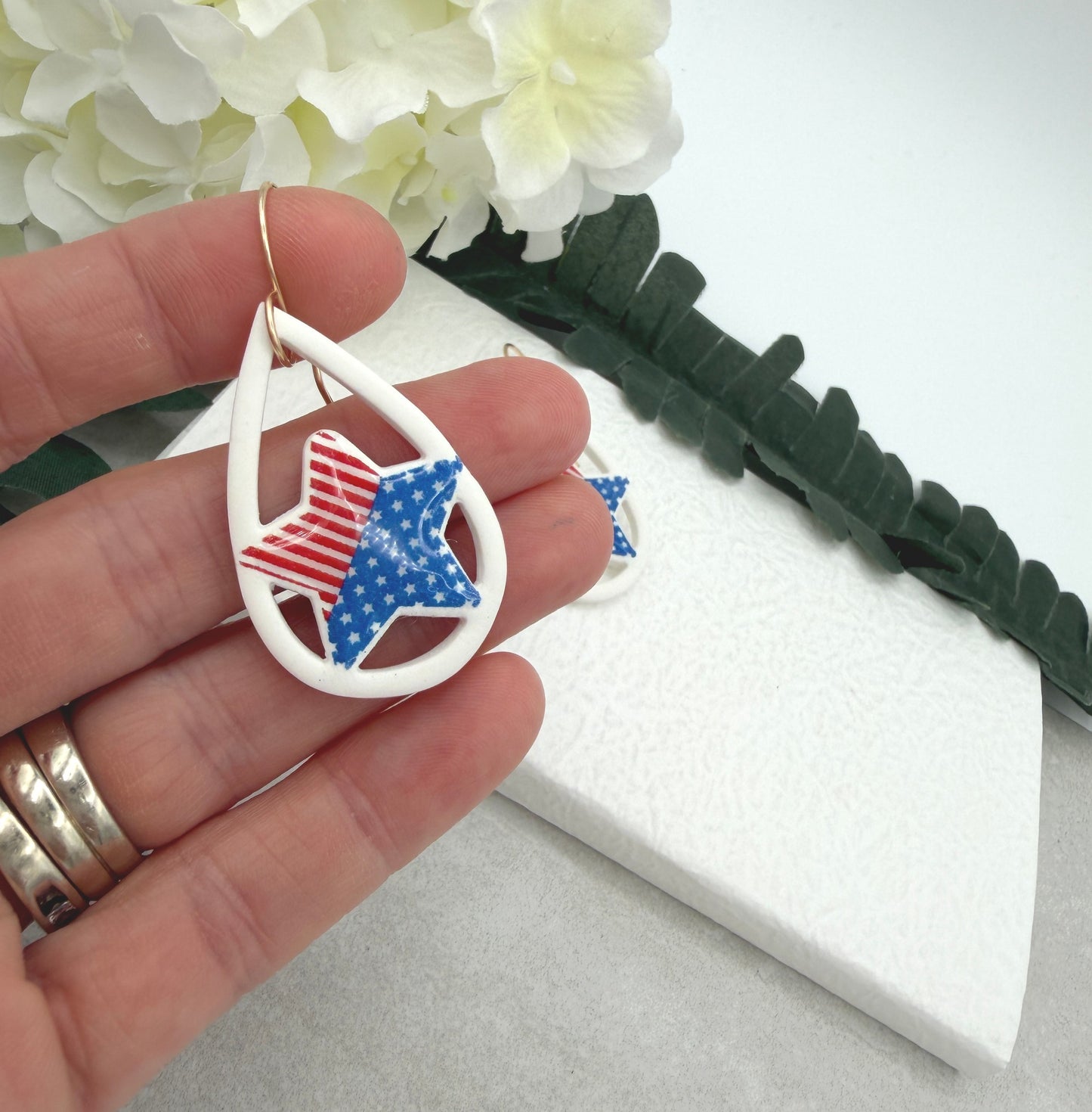 Earrings Made with White Polymer Clay Lined, Teardrop Frames with Stars and Strips Stars PCE-1036