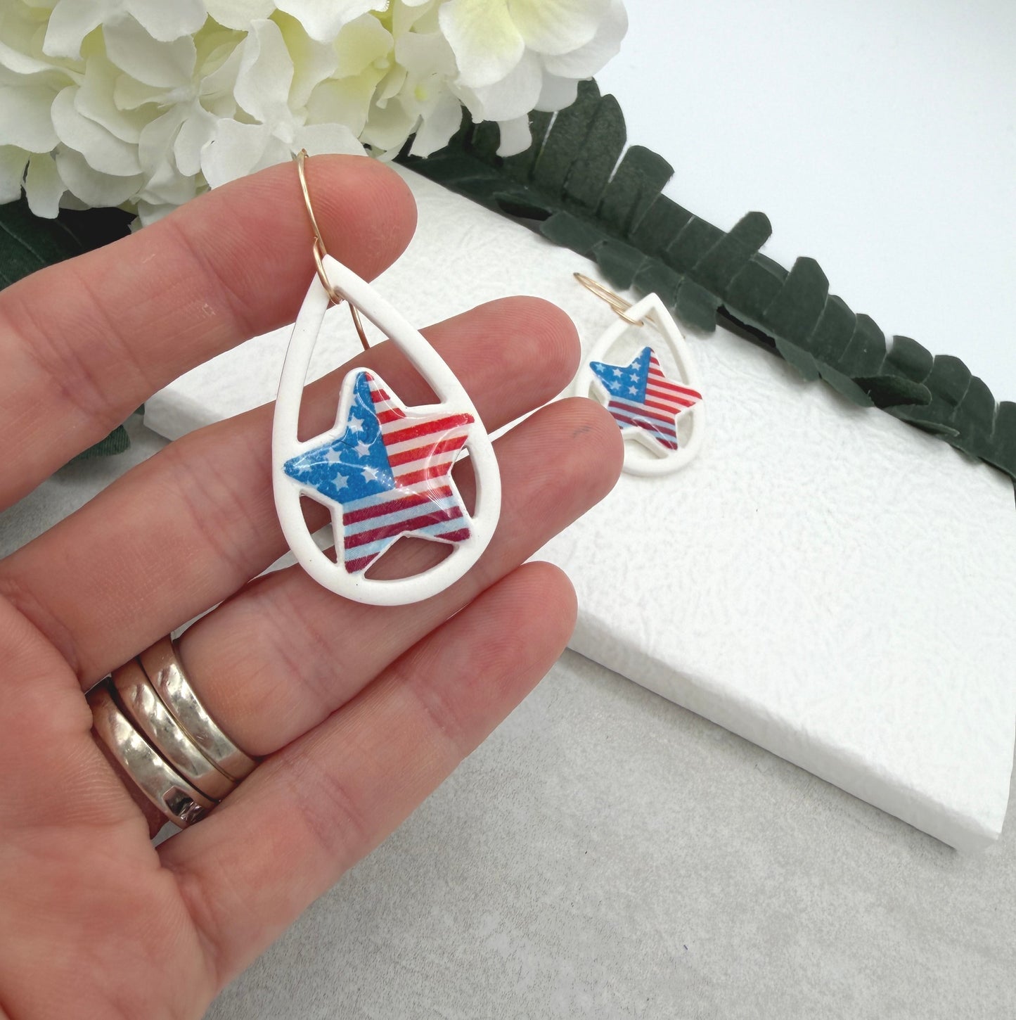 Earrings Made with White Polymer Clay Lined, Teardrop Frames with American Flag Stars PCE-1037