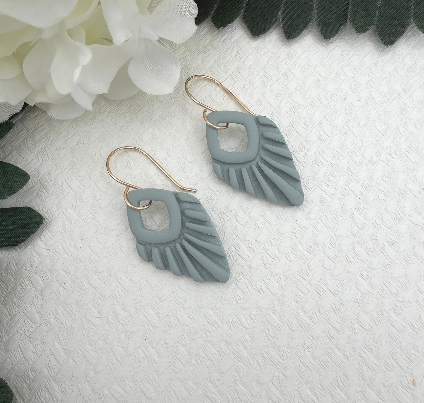 Earrings Made with Blue Polymer Clay Shaped into Lined, Teardrop Frames PCE-1041