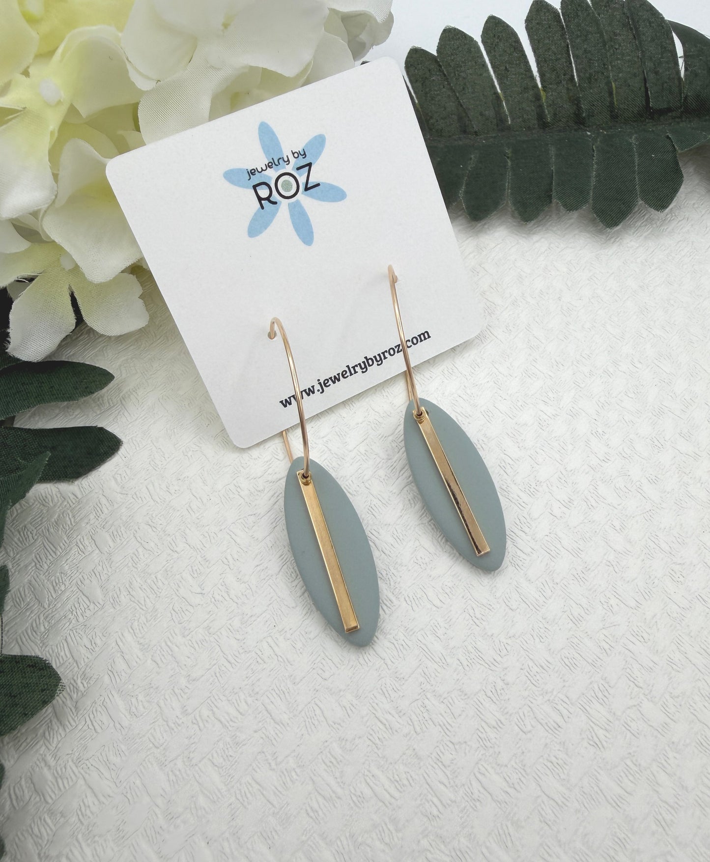 Earrings Made with Blue Polymer Clay Shaped into Ovals with Gold Plated LInes on Hoops PCE-1043