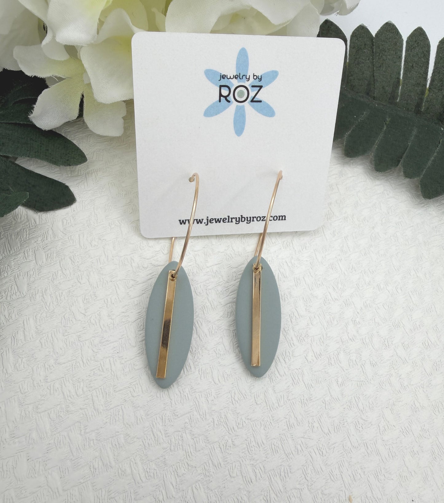Earrings Made with Blue Polymer Clay Shaped into Ovals with Gold Plated LInes on Hoops PCE-1043