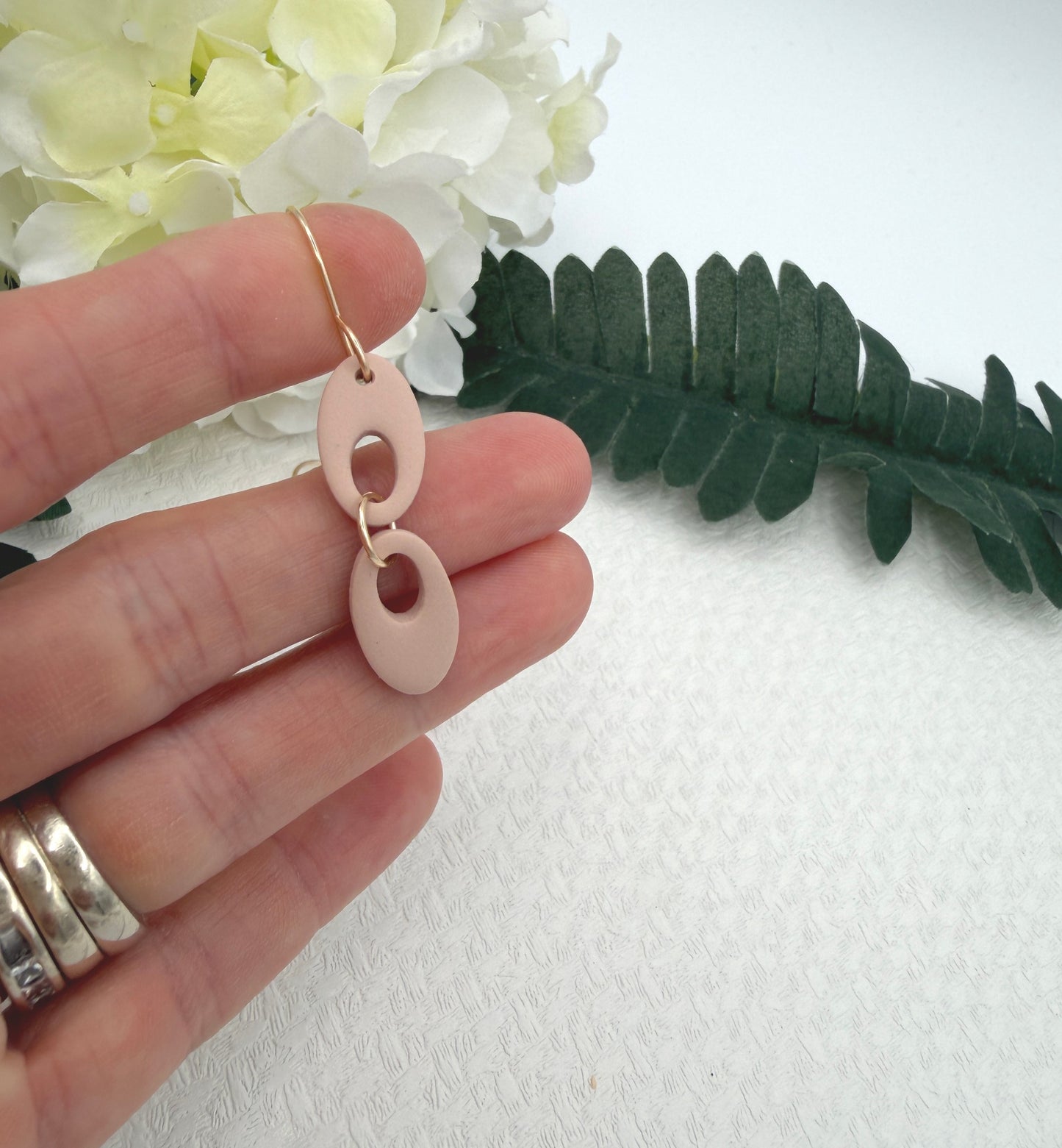 Earrings Made with Dusty Coral Polymer Clay Shaped into Two Rounded Teardrops PCE-1047