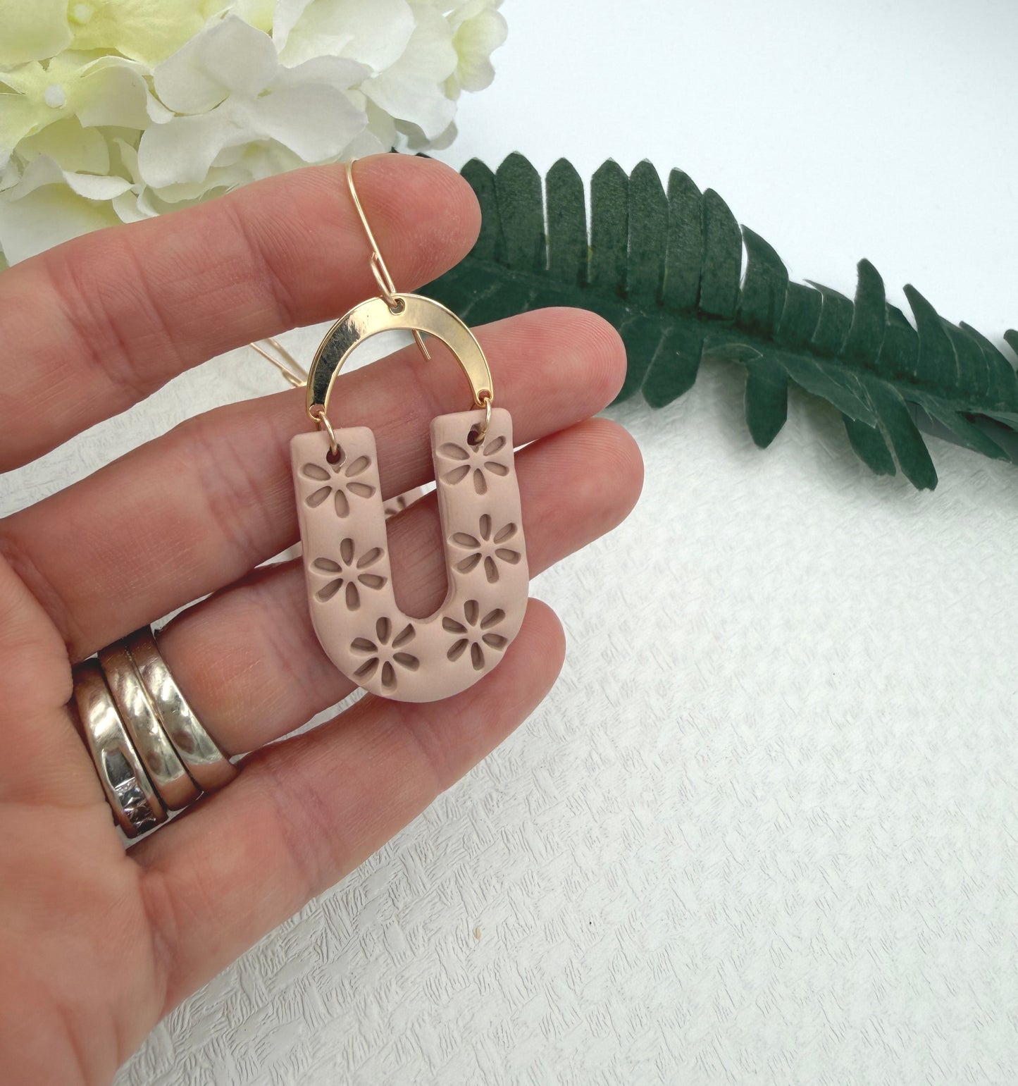 Earrings Made with Dusty Coral Polymer Clay Shaped into Flowered Arches with Gold Plated Arches PCE-1048