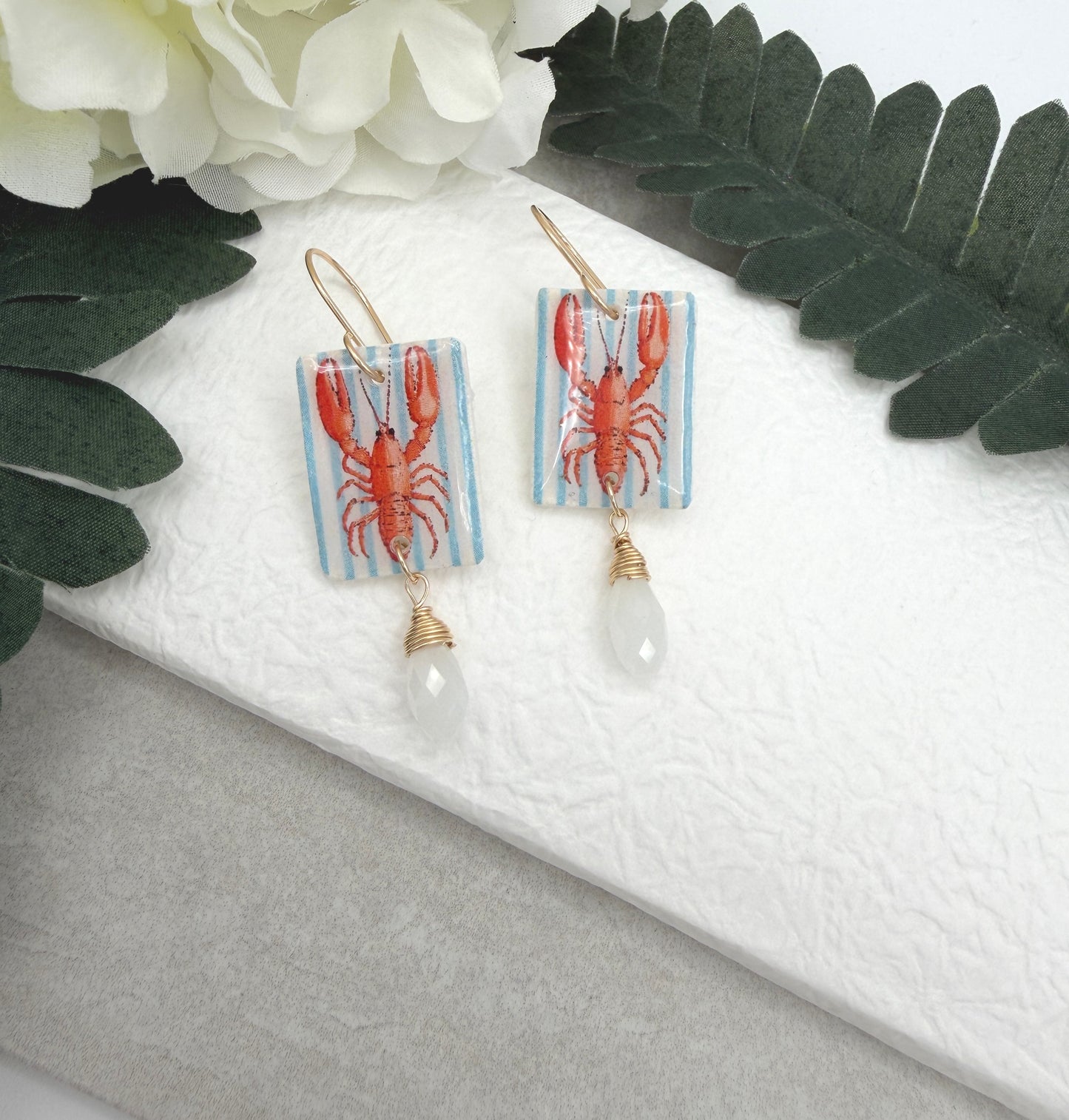 Earrings Made with White Polymer Clay with a Lobster Design and White Crystal Drop PCE-1056