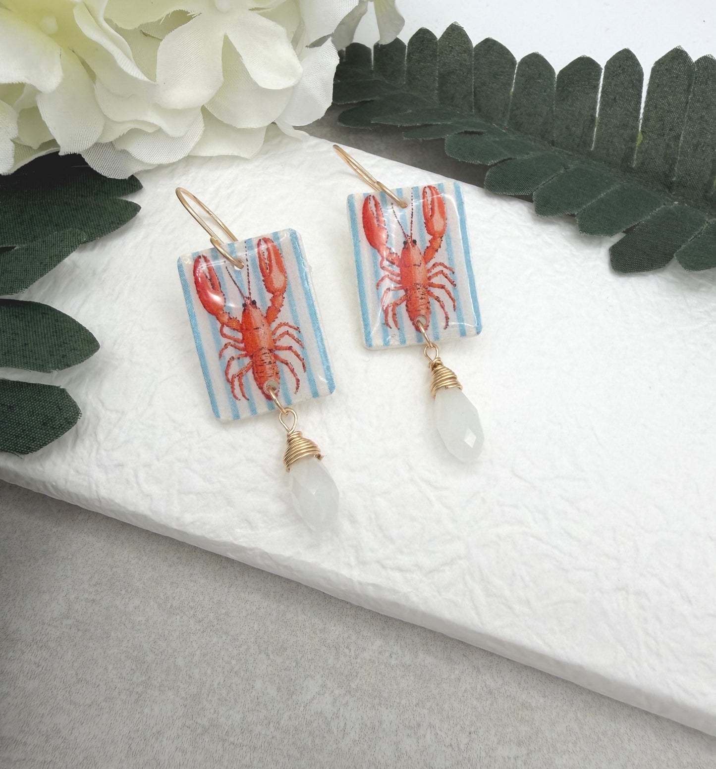 Earrings Made with White Polymer Clay with a Lobster Design and White Crystal Drop PCE-1056