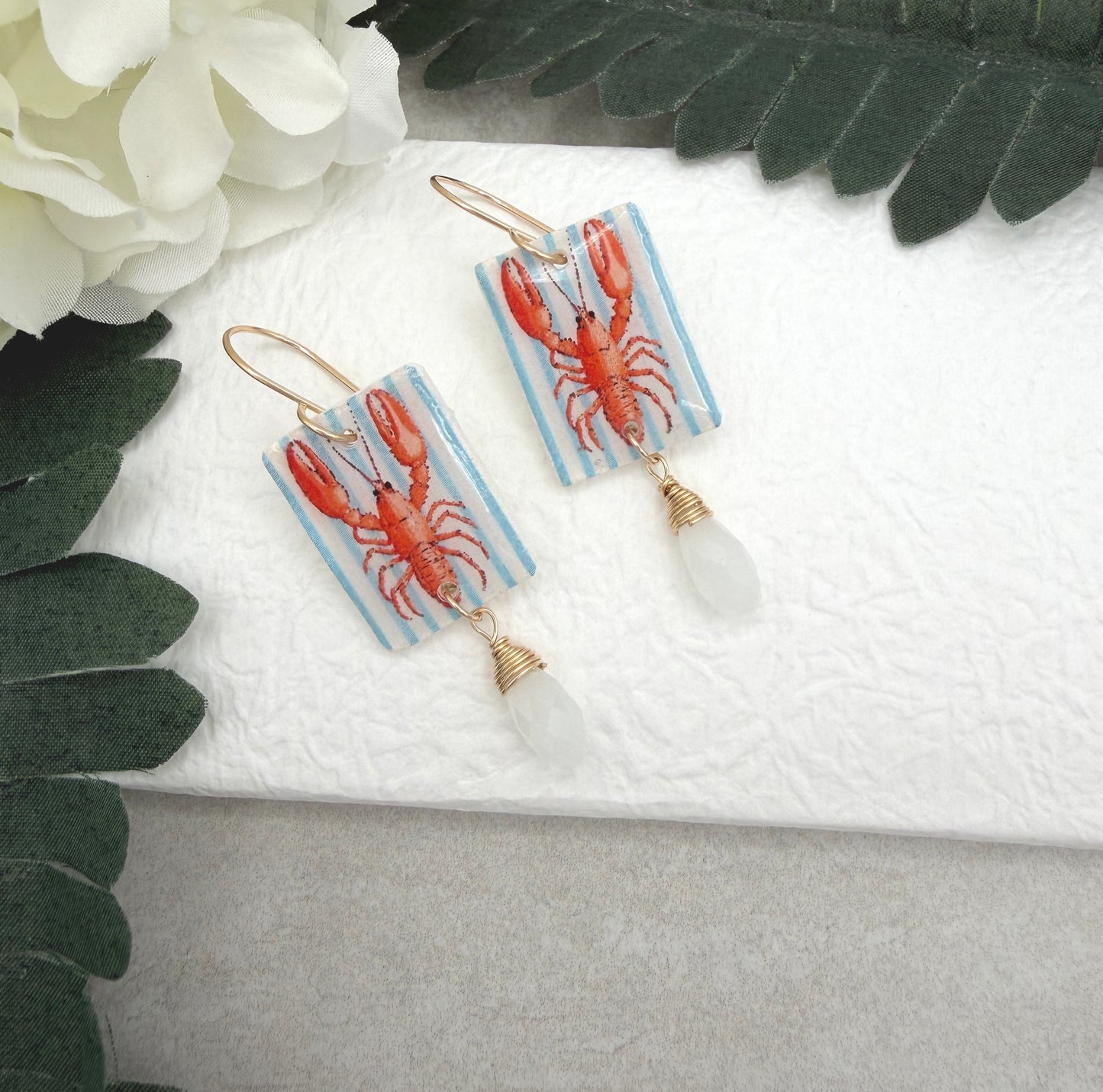Earrings Made with White Polymer Clay with a Lobster Design and White Crystal Drop PCE-1056