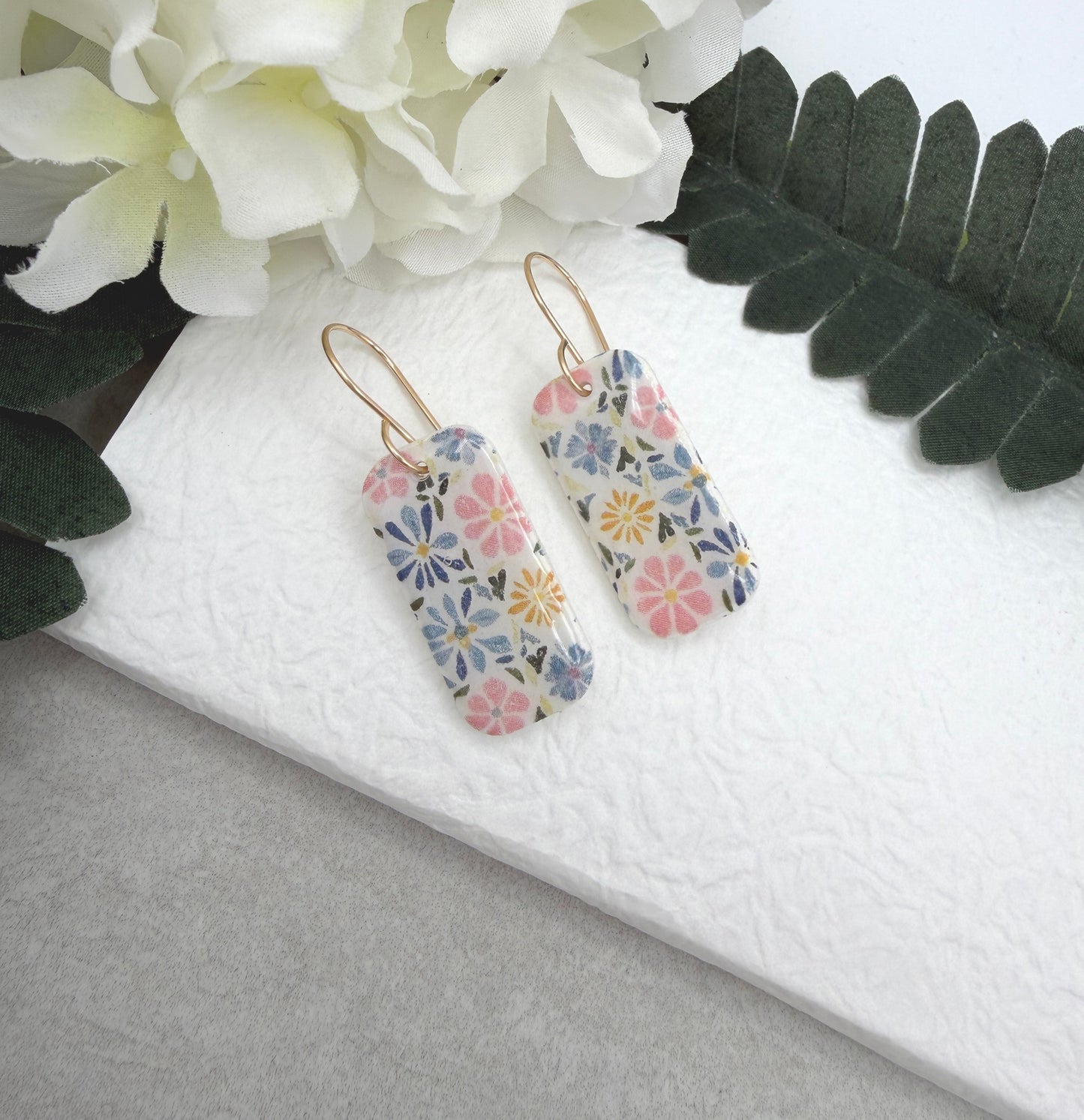 Earrings Made with White Polymer Clay with a PInk, Blue, Yellow Floral Design PCE-1060