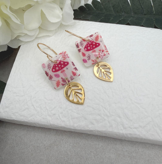 Earrings Made with White Polymer Clay with a Mushroom Pattern and Gold Plated Leaf Charms PCE-1064