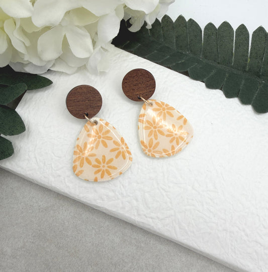 Earrings Made with White Polymer Clay Teardrops with a Yellow Flower Pattern and Wood Posts PCE-1067