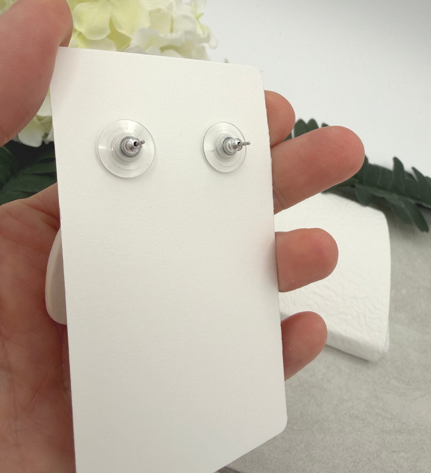 Earrings Made with White Polymer Clay Teardrops with a Yellow Flower Pattern and Wood Posts PCE-1067