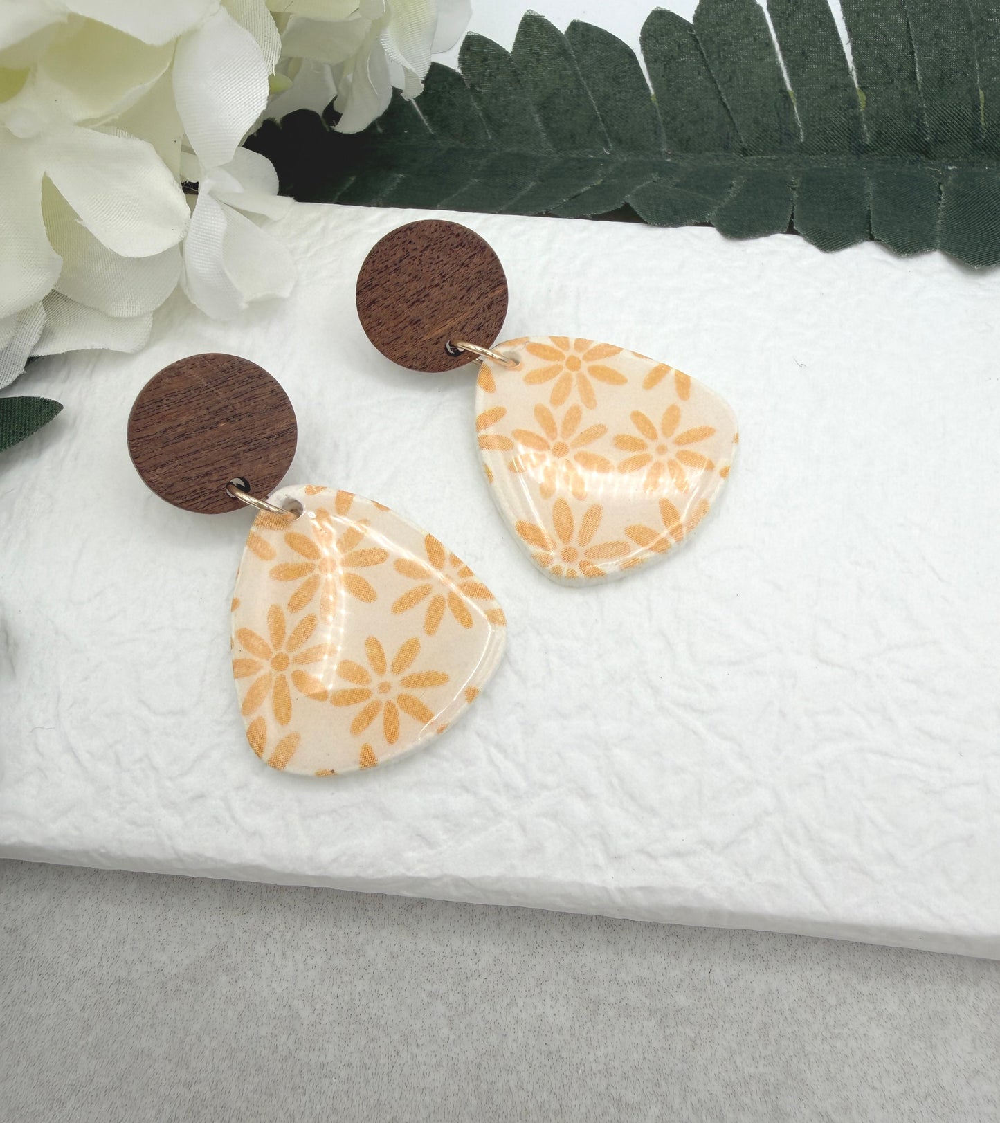 Earrings Made with White Polymer Clay Teardrops with a Yellow Flower Pattern and Wood Posts PCE-1067