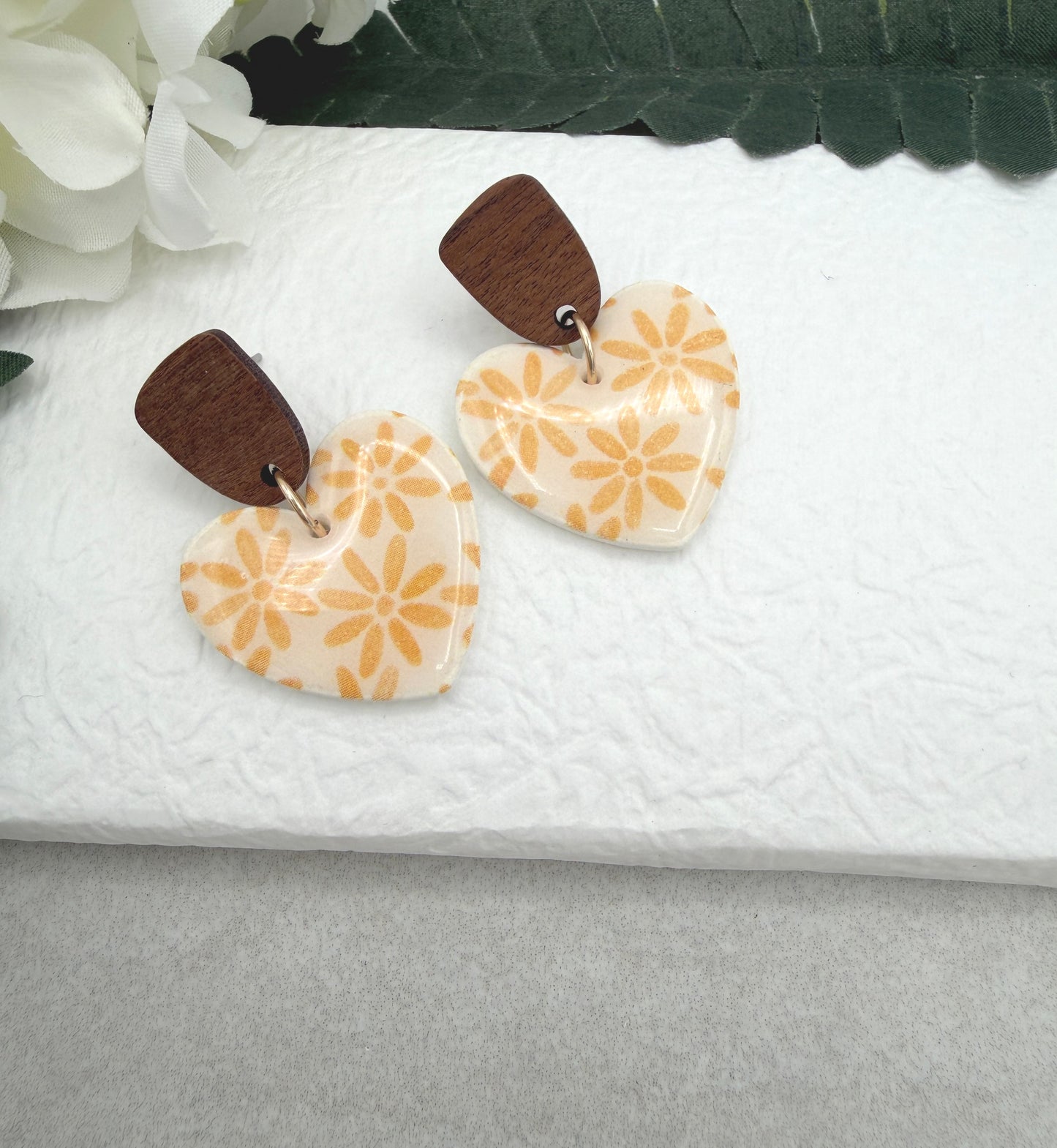 Earrings Made with White Polymer Clay Hearts with a Yellow Flower Pattern and Wood Posts PCE-1068