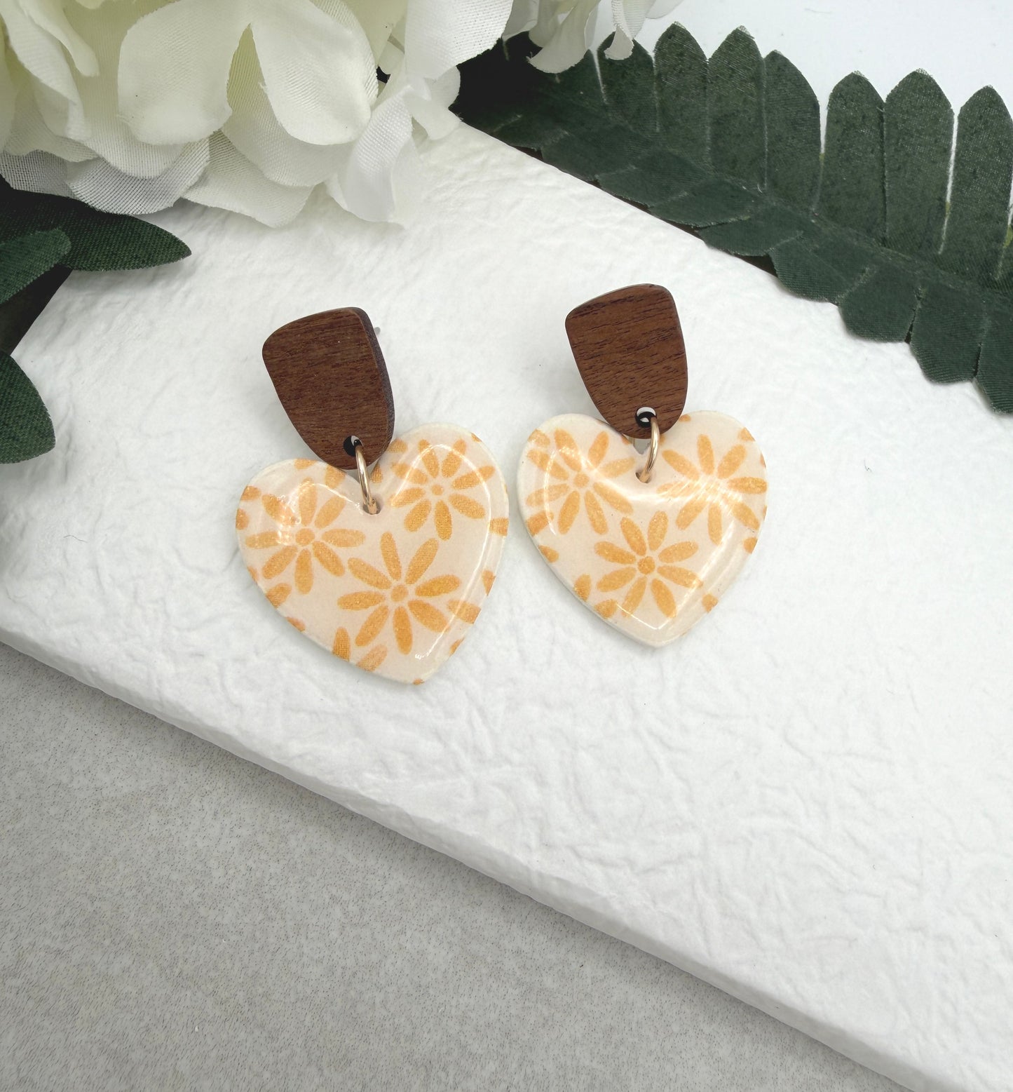 Earrings Made with White Polymer Clay Hearts with a Yellow Flower Pattern and Wood Posts PCE-1068