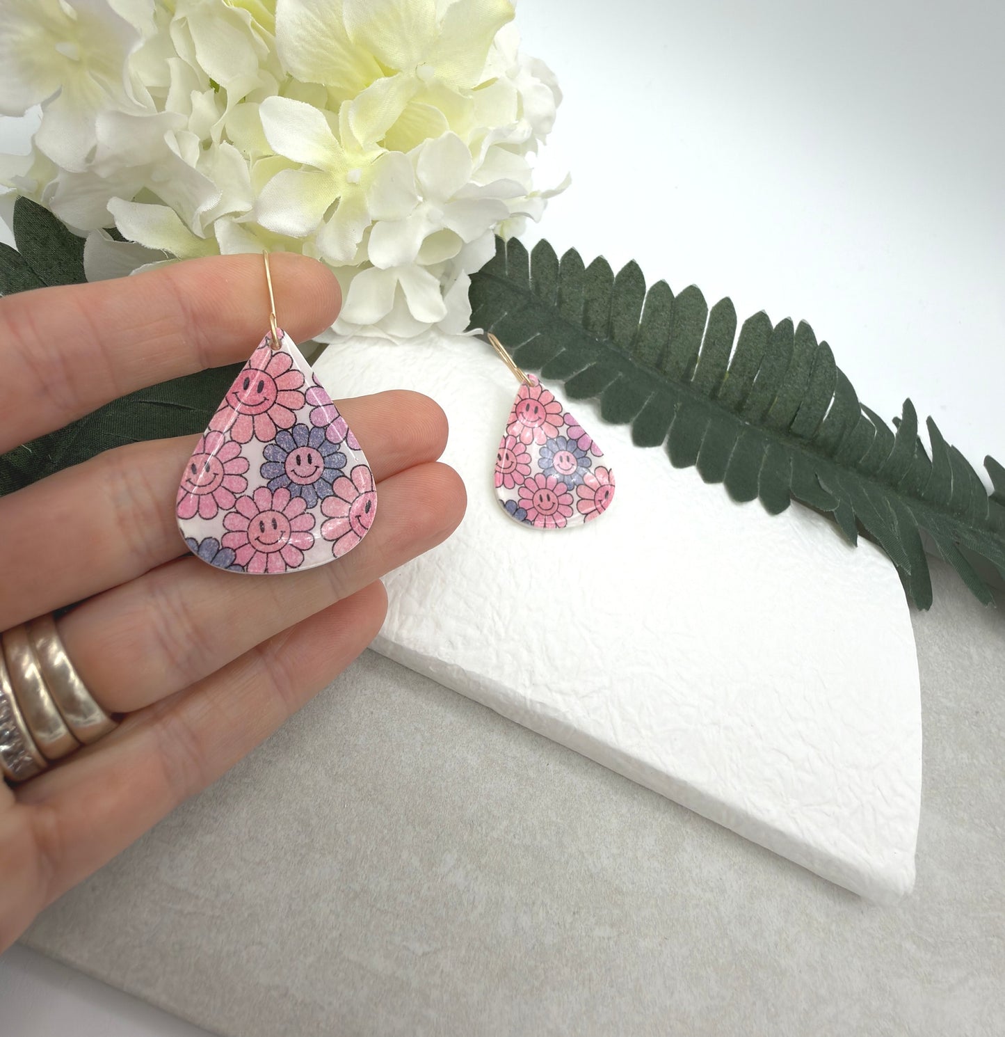 Earrings Made with White Polymer Clay Teardrops with a Smiley Face Flower Pattern PCE-1074