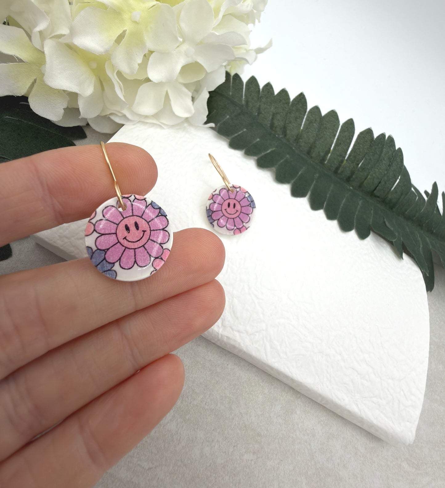 Earrings Made with White Polymer Clay Circles with a Smiley Face Flower Pattern PCE-1076