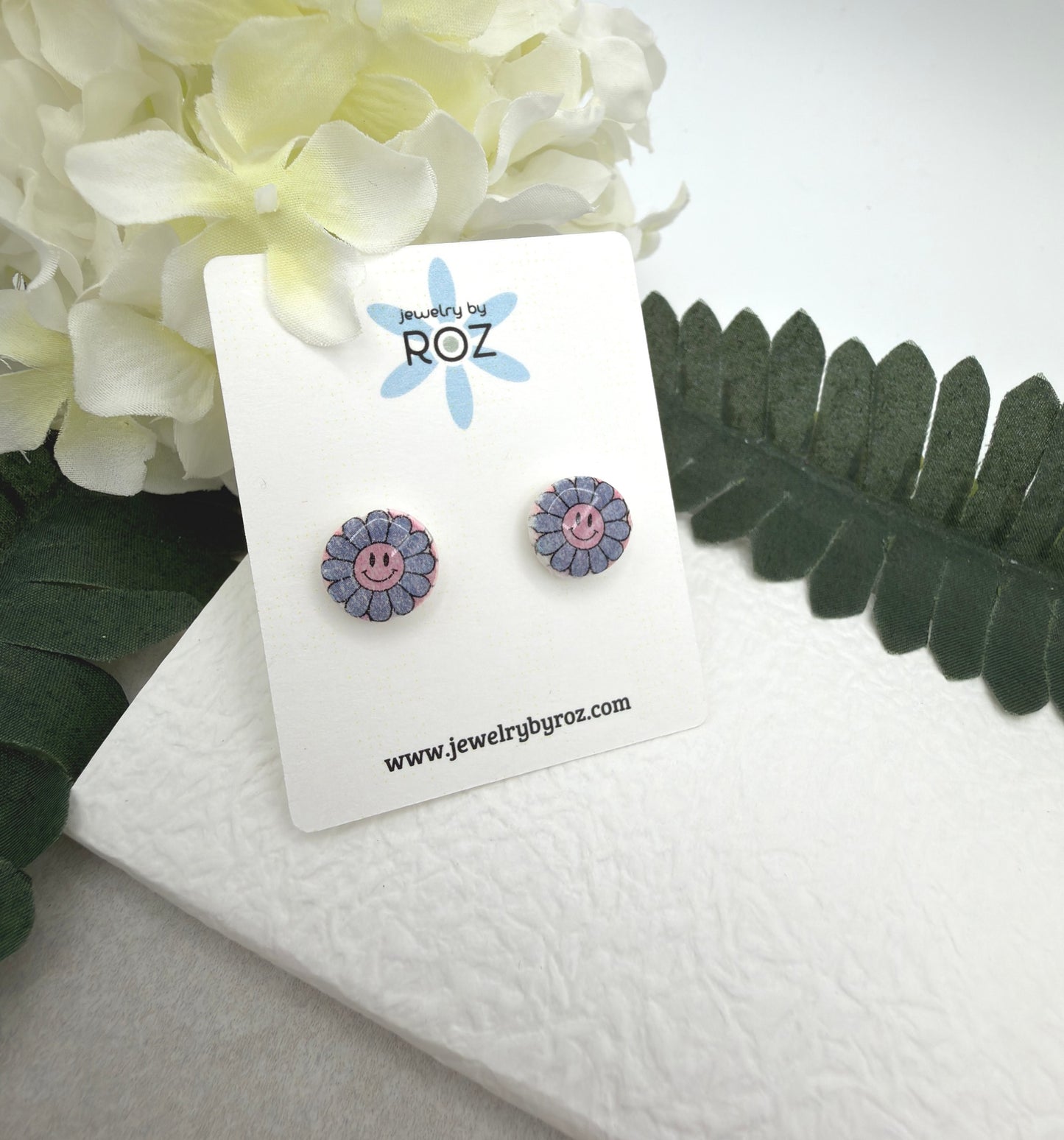 Stud Earrings Made with White Polymer Clay with Blue Smiley Face Flowers and Sterling Silver Posts PCE-1077
