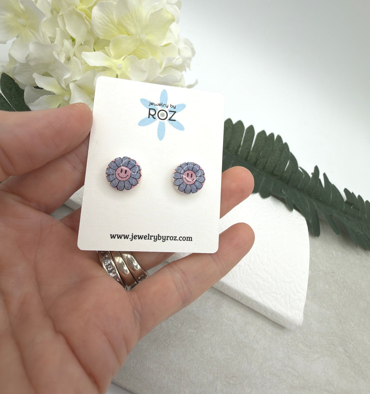 Stud Earrings Made with White Polymer Clay with Blue Smiley Face Flowers and Sterling Silver Posts PCE-1077