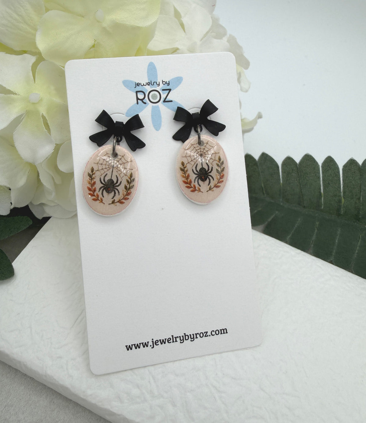 Earrings Made with Black Bow Posts and Polymer Clay Ovals with a Spider Design PCE-1082