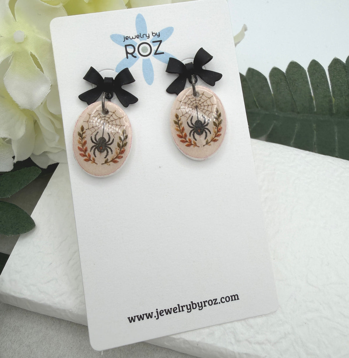 Earrings Made with Black Bow Posts and Polymer Clay Ovals with a Spider Design PCE-1082
