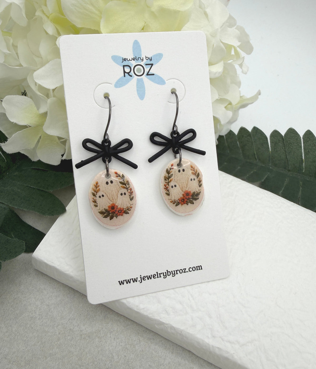 Earrings Made with Black Bow LInks and Polymer Clay Ovals with a Ghost Design and Oxidized Silver Earring Wires PCE-1084